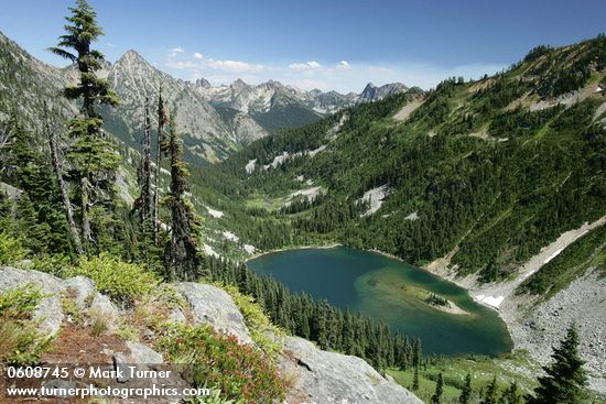Lake Ann in glacial cirque w/ Whistler Mtn on left skyline, Liberty Bell bkgnd (view east fr near Maple Pass)